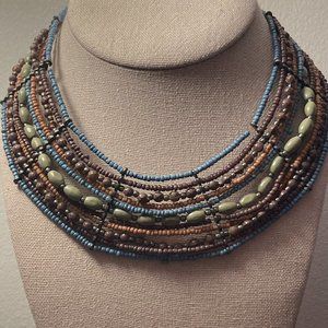 10 strand necklace with seed beads, round reads and oval beads